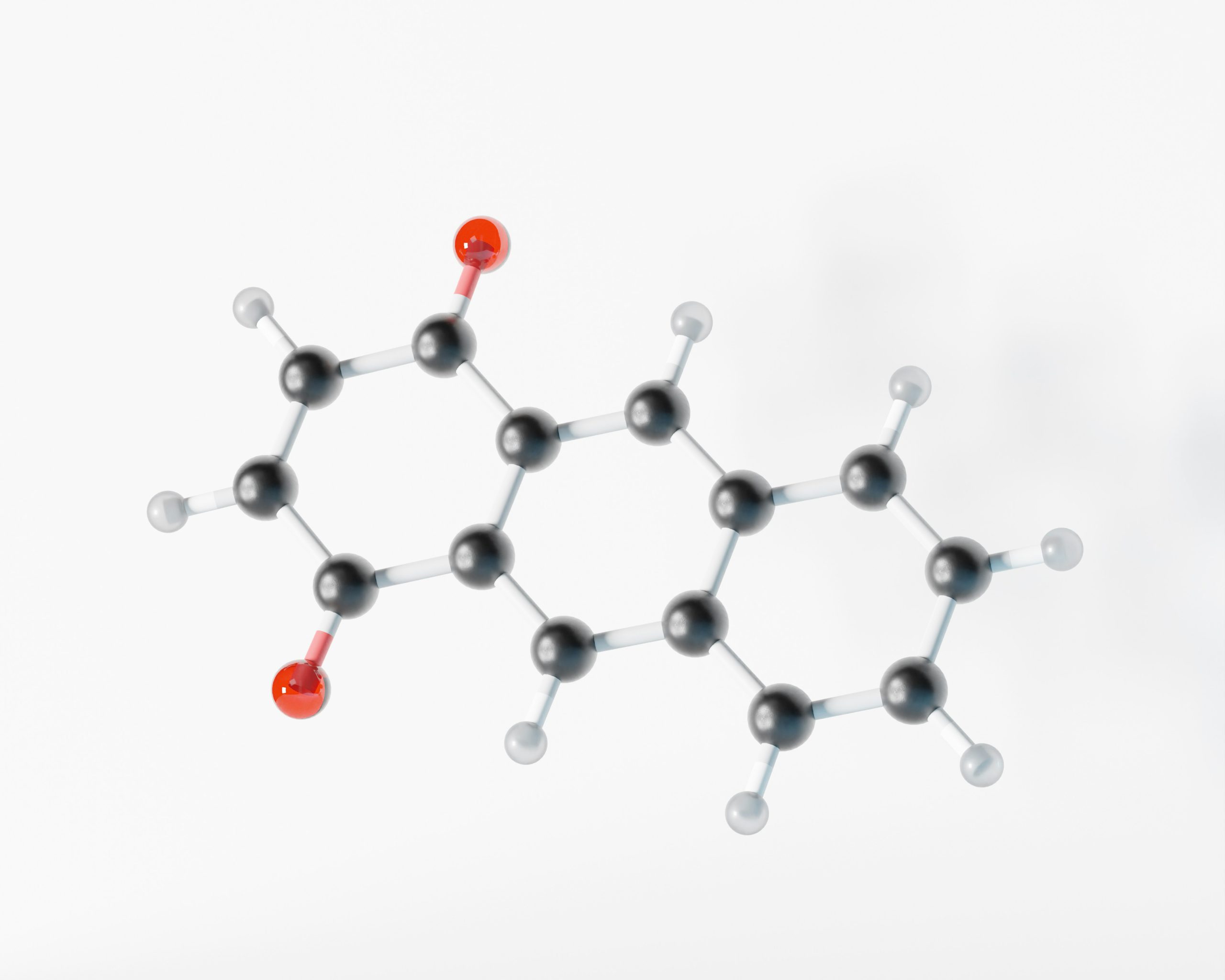 3D-Modell eines Moleküls mit schwarzen und weißen Atomen sowie roten Sauerstoffatomen, das eine chemische Struktur darstellt